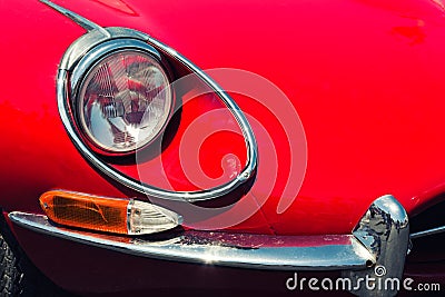 Headlight of a red retro car