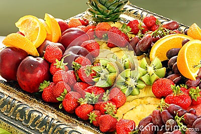 Healthy fruit breakfast with strawberry grape pineapple and kiwi