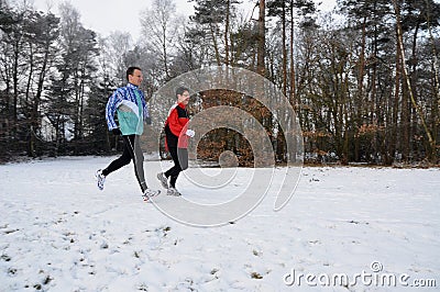 Healthy people running in the snow