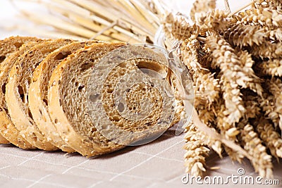 Healthy whole grain sliced bread with sunflower seeds on brown n