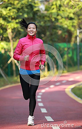 Healthy woman running at park