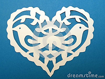 Heart with birds. Paper cutting.