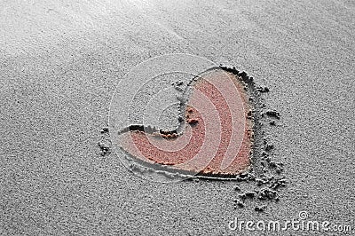 Heart drawing on the sand beach