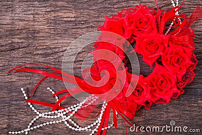 Heart shaped roses bouquet on wooden table