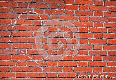 Heart sign drawn by white chalk on red brick wall,