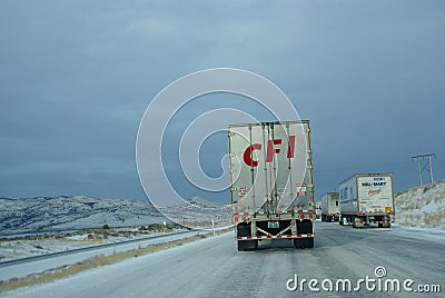 Heavy trucks speeding on icy freeway