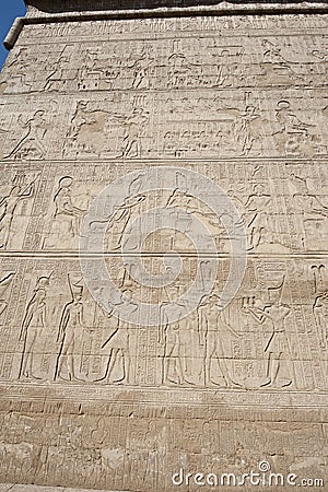 Hieroglyphic carvings on an egyptian temple wall