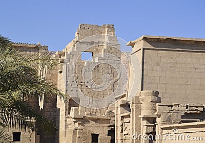 Hieroglyphic carvings on an egyptian temple wall