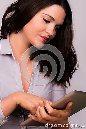 Beautiful young female using an ipad tablet device