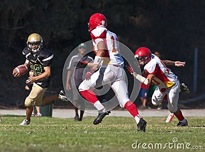 High School Football Player Running with the Ball