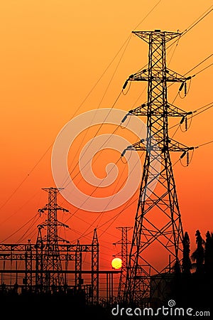 High voltage electric pillar on sunset background
