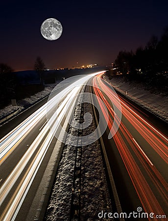 Highway at night with full moon