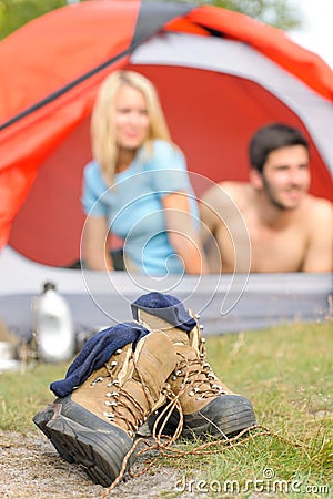 Hiking boots outside tent camping couple