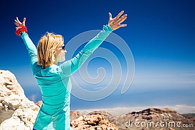 Hiking success, woman on trail in mountains