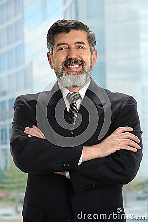Hispanic Businessman Near Window