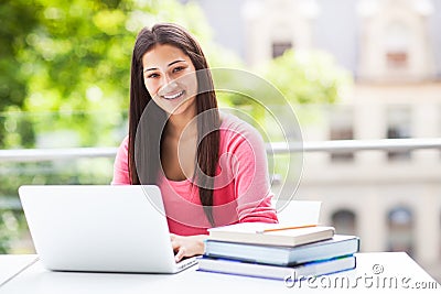 Hispanic college student with laptop