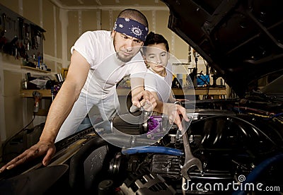 Hispanic father and son in garage