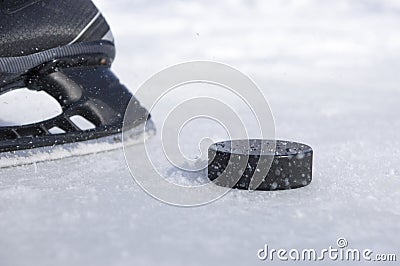 Hockey skate and puck