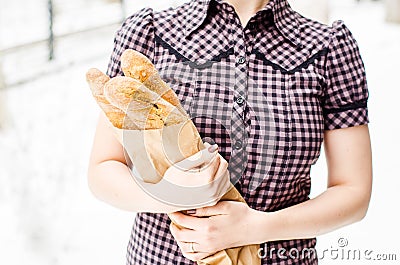 Woman with baguettes
