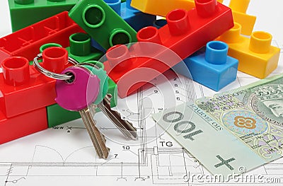 Home keys, colorful building blocks and money on housing plan