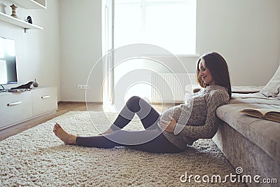 Home portrait of pregnant woman