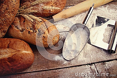 Homemade breads with cooking utensils