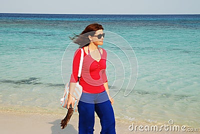 Roatan, Bay Islands, Honduras; A Young Woman Snorkeling At 