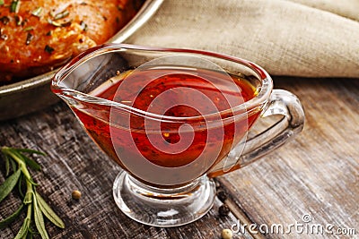 Honey and pepper red marinade in glass gravy boat