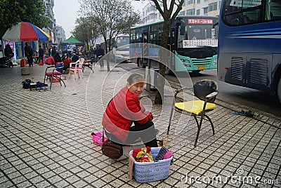 Hong Jiang, China: street cleaning shoes