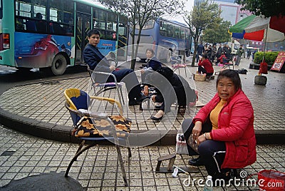 Hong Jiang, China: street cleaning shoes