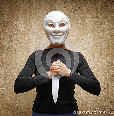 Woman in white mask holding the knife