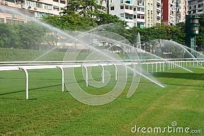 Horse racing track with sprinkler