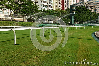 Horse racing track with sprinkler