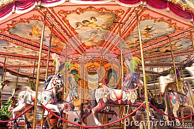 Horse rides on a merry-go-round carousel