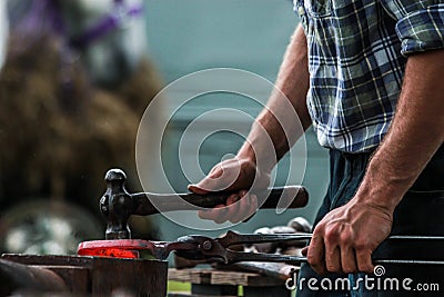 Horse shoe being crafted by blacksmith/farrier