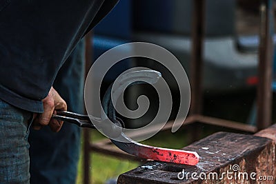 Horse shoe being crafted by blacksmith/farrier