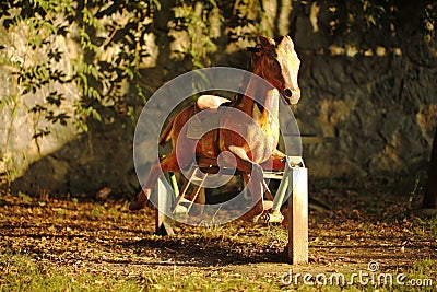 A horse toy old style in an outdoor playground