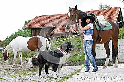 With horses and dog