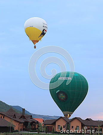 Hot air balloons landing on courtyards