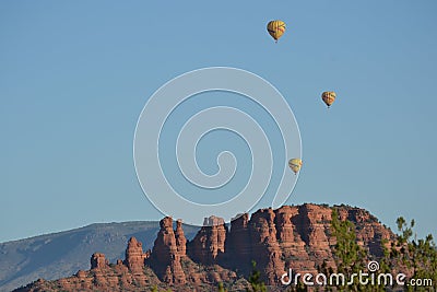 Hot air balloons over the desert red rocks of Sedo