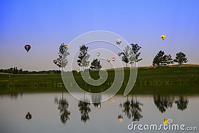 Hot air balloons over the lake