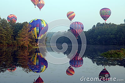 Hot air balloons over water