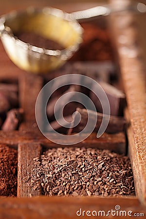 Hot chocolate flakes in old rustic wooden spicy box