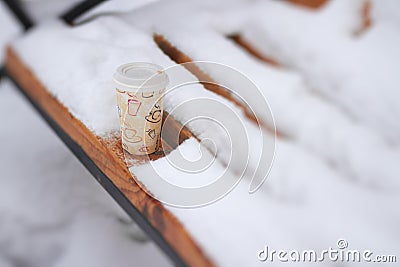 Hot coffee in cold winter day outdoors
