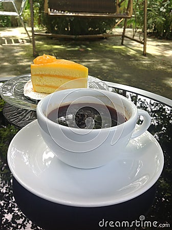 Hot coffee cup with cake.