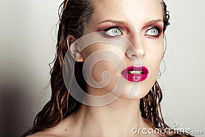 Hot young woman model with sexy bright red lips makeup