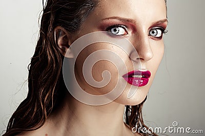 Hot young woman model with sexy bright red lips makeup