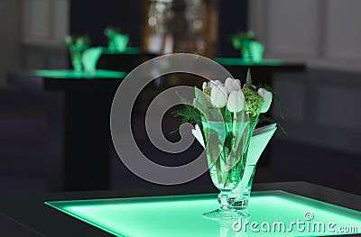 Hotel ballroom with luminous bar tables