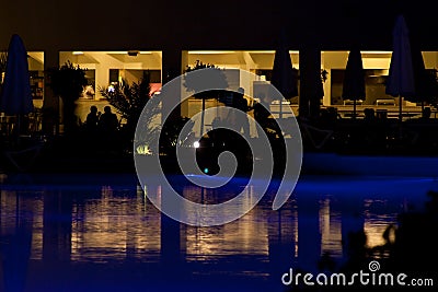 Hotel and swimming pool at night