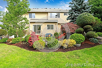 House with backyard tropical garden and lawn